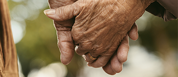 Two people holding hands