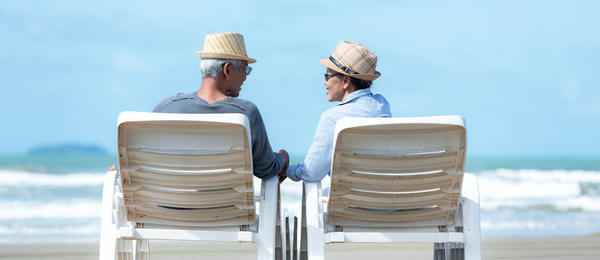 Man and woman sitting on beach